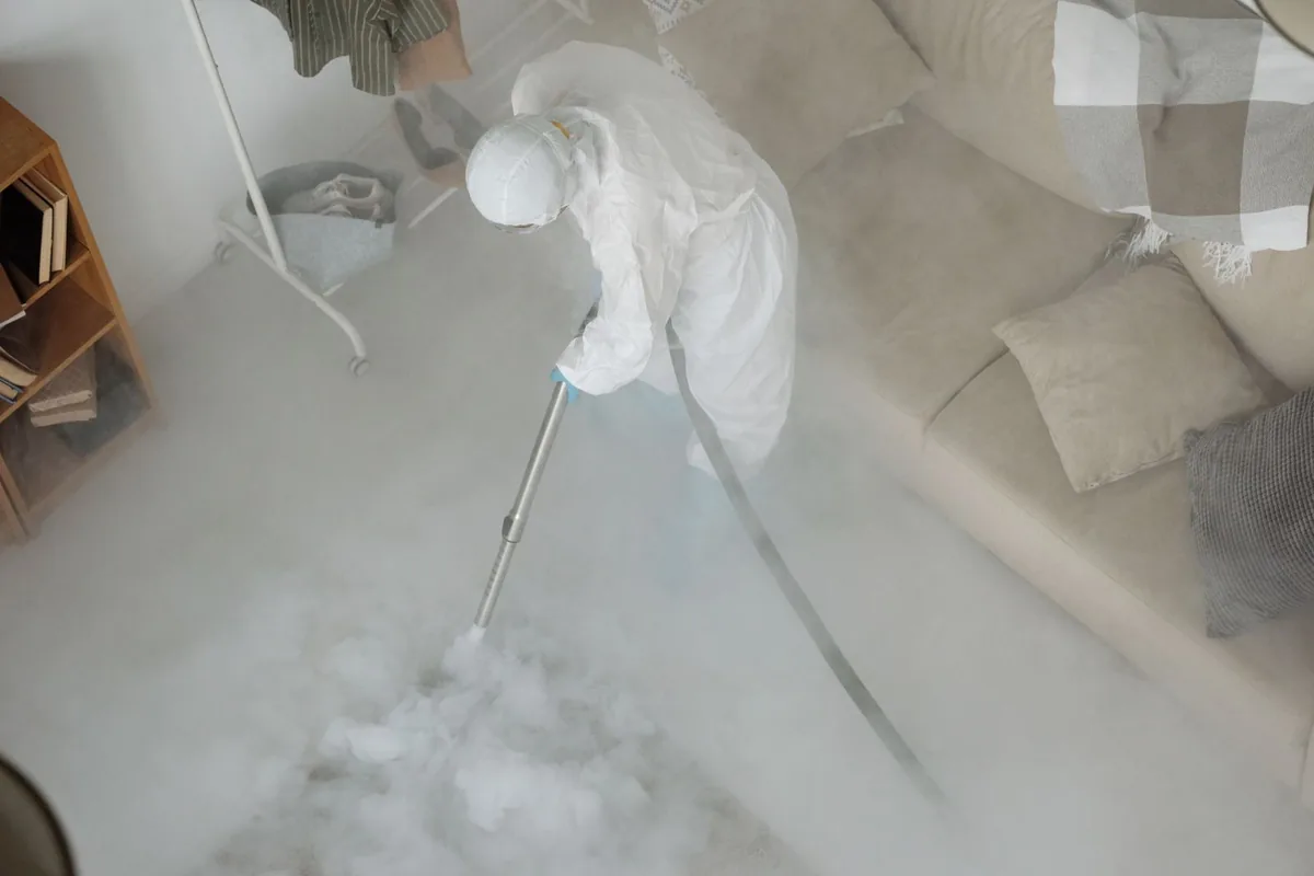 Biohazard cleanup technician in protective equipment, Central Lawrenceville, Pittsburgh, PA